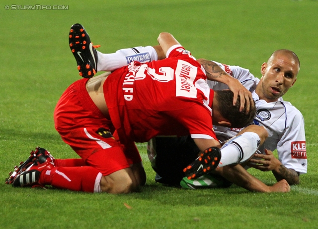 Admira - Sturm Graz
Oesterreichische Fussball Bundesliga, 7. Runde,  FC Admira - SK Sturm Graz, Stadion Suedstadt, 10.9.2011. 

Foto zeigt Richard Windbichler (Admira) und Patrick Wolf (Sturm)
