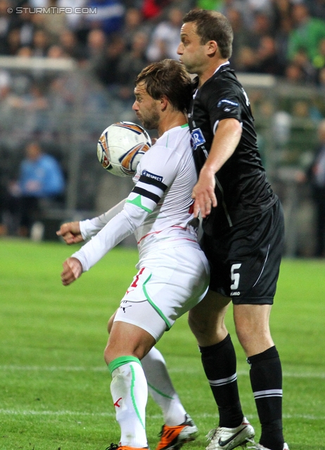 Sturm-Lok Moskau
UEFA Europa League Gruppenphase 1. Spieltag,  SK Sturm Graz - FC Lokomotiv Moskau, Stadion Liebenau, 15.9.2011. 

Foto zeigt Dmitri Sychev (Lok Moskau) und Ferdinand Feldhofer (Sturm) 
