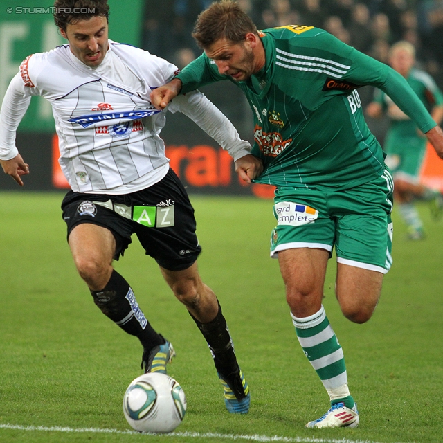 Rapid - Sturm Graz
Oesterreichische Fussball Bundesliga, 13. Runde,  SK Rapid Wien - SK Sturm Graz, Gerhard Hanappi Stadion Wien, 29.10.2011. 

Foto zeigt Joachim Standfest (Sturm) und Guido Burgstaller (Rapid)
Schlüsselwörter: zweikampf