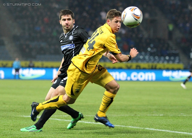 Sturm Graz - AEK Athen
UEFA Europa League Gruppenphase 6. Spieltag, SK Sturm Graz - AEK Athen, Stadion Liebenau Graz, 14.12.2011. 

Foto zeigt Giorgi Popkhadze (Sturm) und Nathan Burns (AEK Athen)
