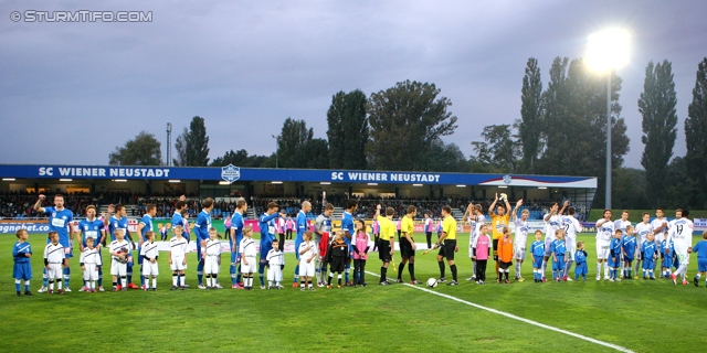 Wr. Neustadt - Sturm Graz
Oesterreichische Fussball Bundesliga, 9. Runde,  SC Wiener Neustadt - SK Sturm Graz,Stadion Wiener Neustadt, 22.05.2012. 

Foto zeigt Mannschaft von Wr. Neustadt, das Schiedsrichterteam und die Mannschaft von Sturm
