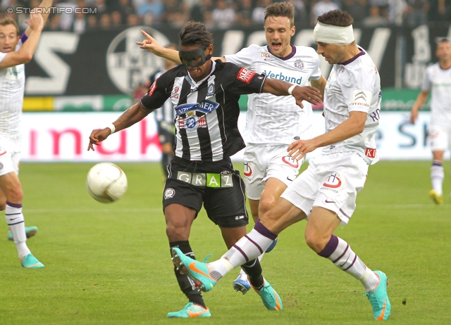 Sturm Graz - Austria Wien
Oesterreichische Fussball Bundesliga, 11. Runde, SK Sturm Graz - FK Austria Wien, Stadion Liebenau Graz, 07.10.2012. 

Foto zeigt Rubin Rafael Okotie (Sturm) und Kaja Rogulj (Austria)
