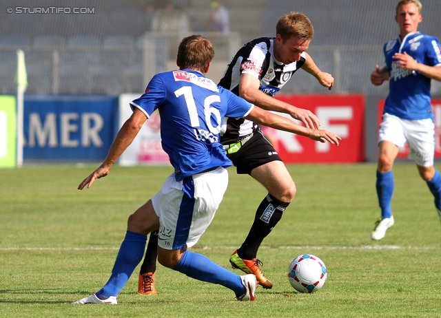 Sturm Graz - Groedig
Oesterreichische Fussball Bundesliga, 2. Runde, SK Sturm Graz - SV Groedig, Stadion Liebenau Graz, 28.07.2013. 

Foto zeigt Mario Leitgeb (Groedig)  und Robert Beric (Sturm)
