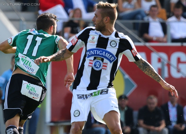 Ried - Sturm Graz
Oesterreichische Fussball Bundesliga, 6. Runde, SV Ried - SK Sturm Graz, Arena Ried, 24.08.2013. 

Foto zeigt Oliver Kragl (Ried) und Patrick Wolf (Sturm)
