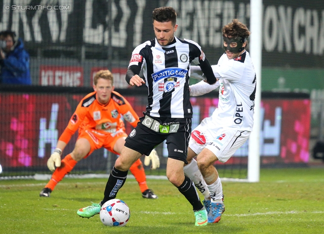 Sturm Graz - Wolfsberg
Oesterreichische Fussball Bundesliga, 25. Runde, SK Sturm Graz -  Wolfsberger AC, Stadion Liebenau Graz, 01.03.2014. 

Foto zeigt Marco Djuricin (Sturm) und Joachim Standfest (Wolfsberg)
