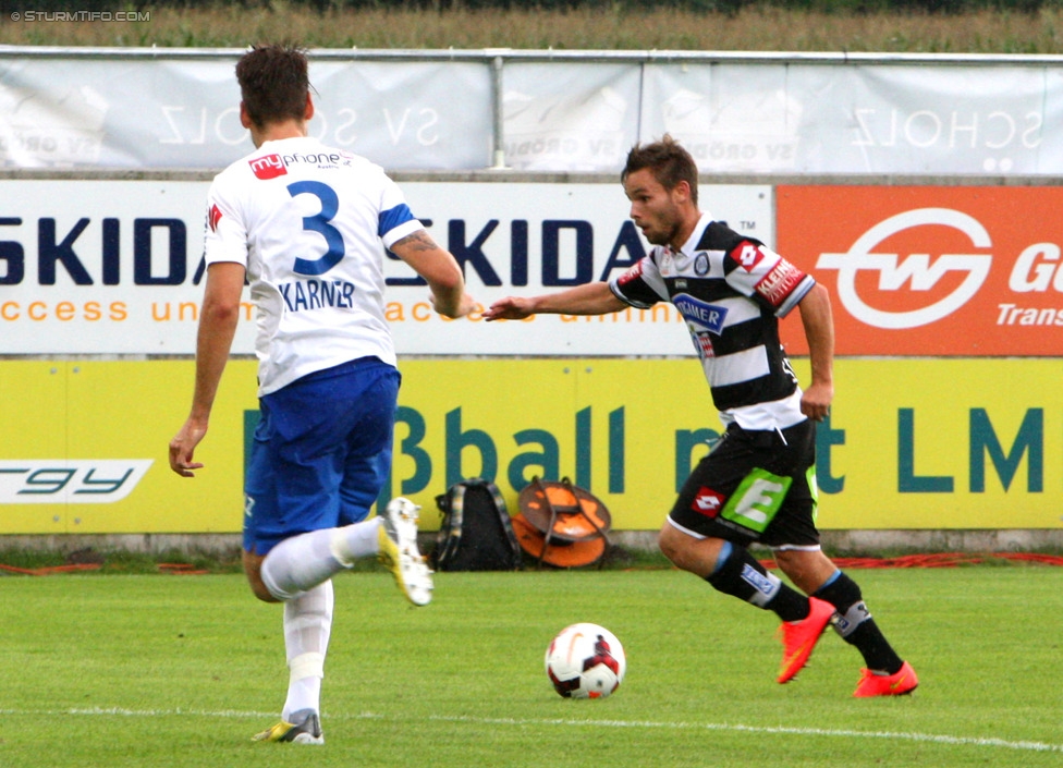 Groedig - Sturm Graz
Oesterreichische Fussball Bundesliga, 2. Runde, SV Groedig - SK Sturm Graz, Untersbergarena Groedig, 27.07.2014. 

Foto zeigt Maximilian Karner (Groedig) und David Schloffer (Sturm)
