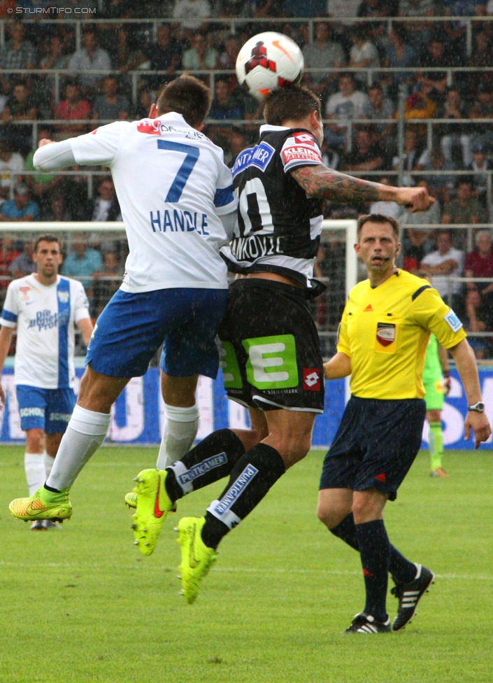 Groedig - Sturm Graz
Oesterreichische Fussball Bundesliga, 2. Runde, SV Groedig - SK Sturm Graz, Untersbergarena Groedig, 27.07.2014. 

Foto zeigt Simon Handle (Groedig) und Marko Stankovic (Sturm)
