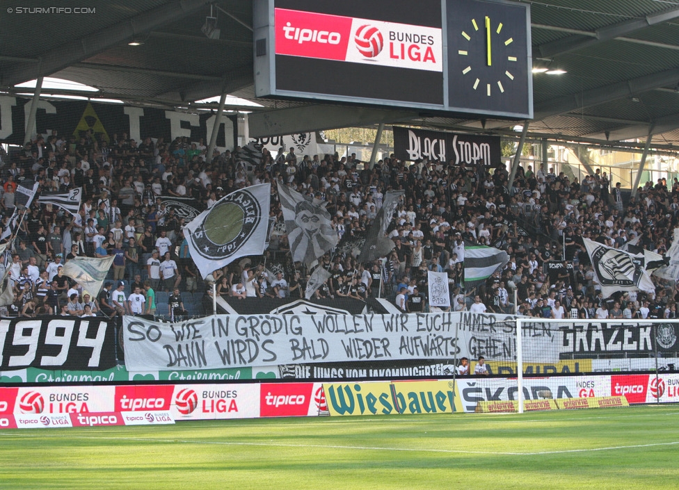 Sturm Graz - Wiener Neustadt
Oesterreichische Fussball Bundesliga, 3. Runde, SK Sturm Graz - SC Wiener Neustadt, Stadion Liebenau Graz, 02.08.2014. 

Foto zeigt Fans von Sturm mit einem Spruchband
