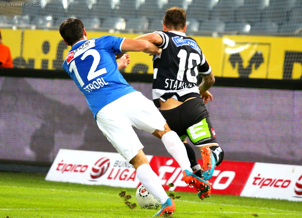 Sturm Graz - Groedig
Oesterreichische Fussball Bundesliga, 11. Runde, SK Sturm Graz - SV Groedig, Stadion Liebenau Graz, 04.10.2014. 

Foto zeigt Robert Strobl (Groedig)  und Marko Stankovic (Sturm)
