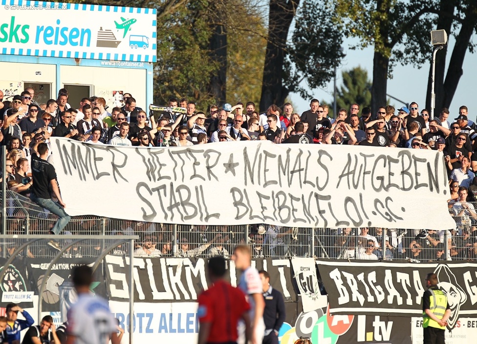 Wiener Neustadt - Sturm Graz
Oesterreichische Fussball Bundesliga, 12. Runde, SC Wiener Neustadt - SK Sturm Graz, Stadion Wiener Neustadt, 19.10.2014. 

Foto zeigt Fans von Sturm mit einem Spruchband
