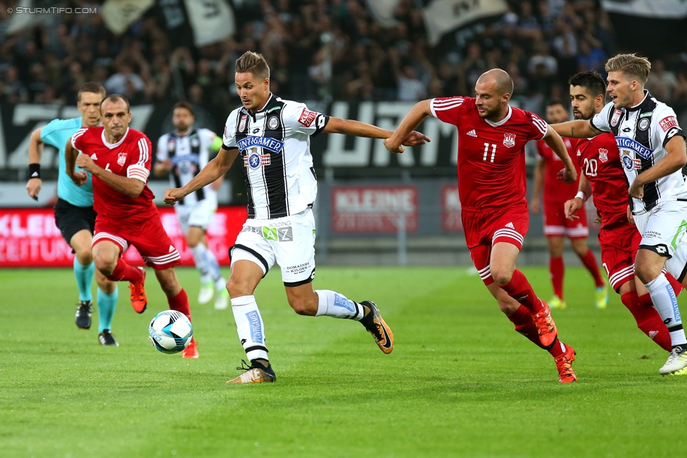 Sturm Graz - Podgorica
UEFA Europa League Qualifikation 2. Runde, SK Sturm Graz -  FK Mladost Podgorica, Stadion Liebenau Graz, 13.07.2017. 

Foto zeigt Thorsten Roecher (Sturm) und Milan Djurisic (Podgorica)
