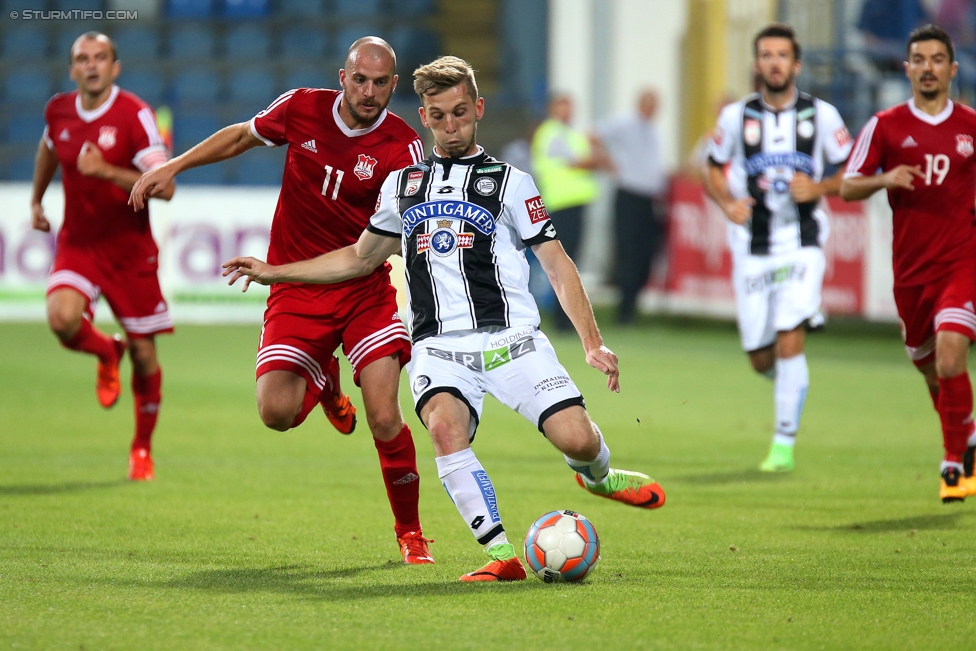 Podgorica - Sturm Graz
UEFA Europa League Qualifikation 2. Runde, FK Mladost Podgorica - SK Sturm Graz, Gradski Stadion Podgorica, 20.07.2017. 

Foto zeigt Milan Djurisic (Podgorica) und Marc Andre Schmerboeck (Sturm)
