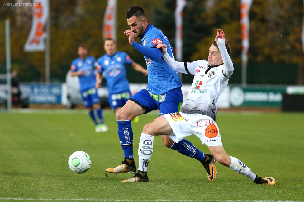 Wolfsberg - Sturm Graz
Oesterreichische Fussball Bundesliga, 13. Runde, Wolfsberger AC - SK Sturm Graz, Lavanttal Arena Wolfsberg, 29.10.2017. 

Foto zeigt Charalampos Lykogiannis (Sturm) und Florian Flecker (Wolfsberg)
