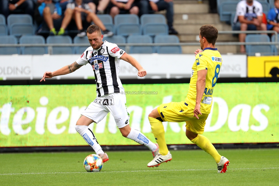 Oesterreichische Fussball Bundesliga, 1. Runde, SK Sturm Graz - SKN St. Poelten, Stadion Liebenau Graz, 28.07.2019. 

Foto zeigt Jakob Jantscher (Sturm) und Michael Ambichl (St. Poelten)
